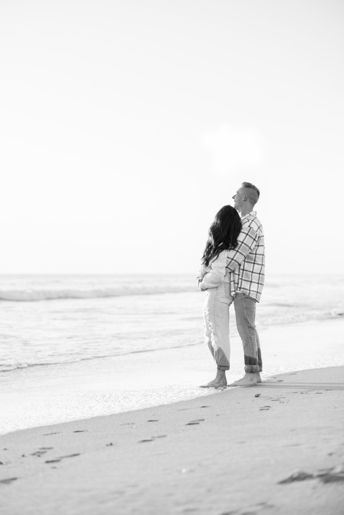 engaged couple on the beach