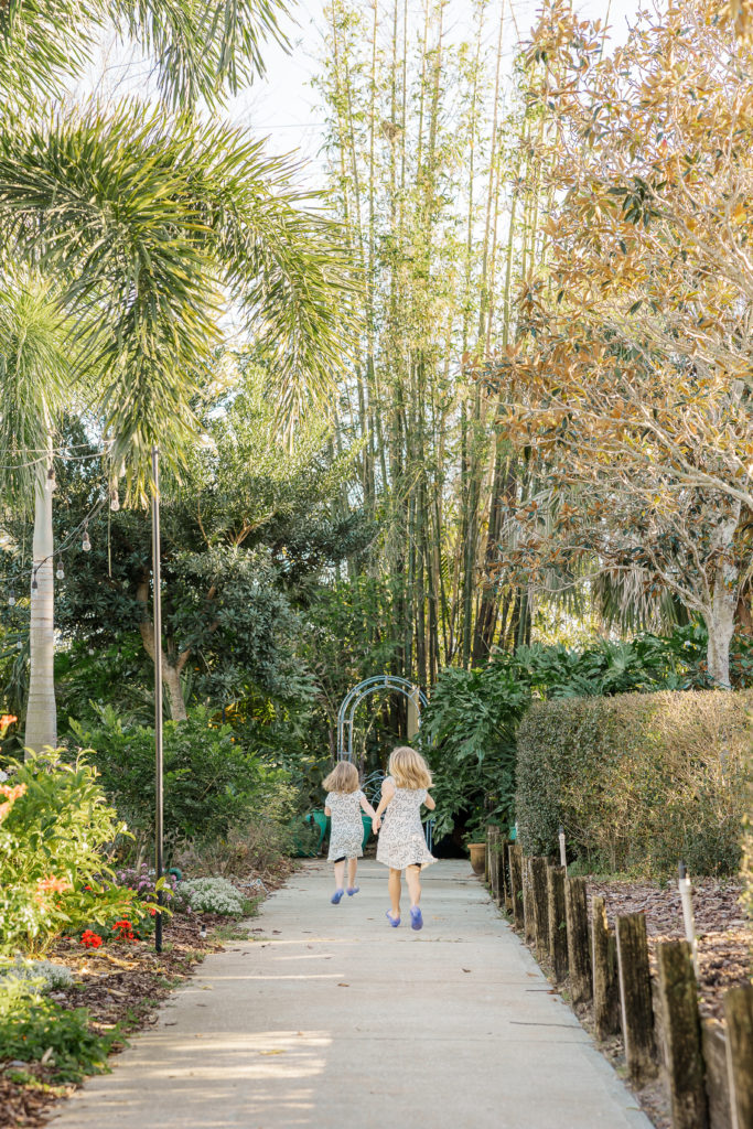 two little girls running down pathway at rockledge gardens
