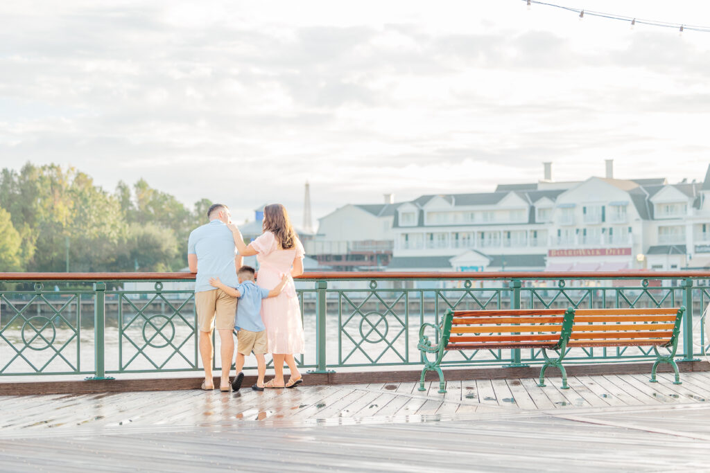 Family of 3 getting family photos taken at Disney's Boardwalk by Alyssa Dougherty Photography