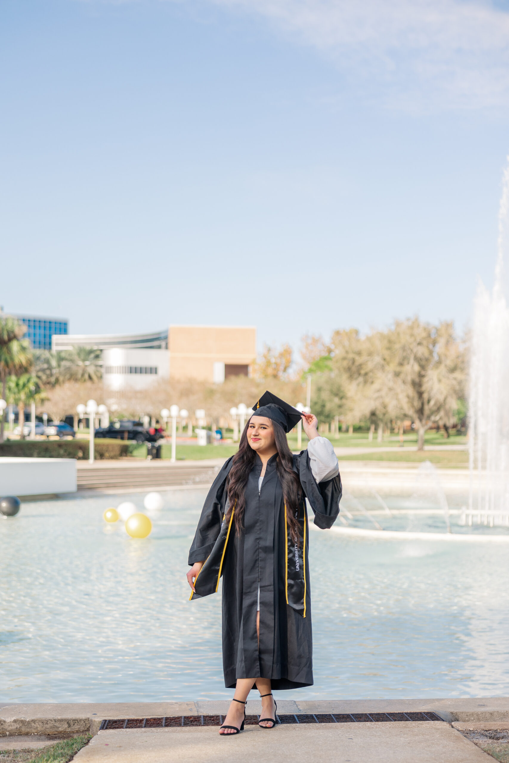 ucf grad photo in front of the fountain