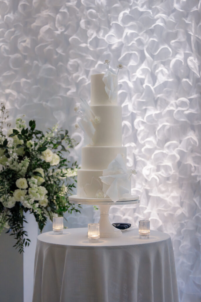 tall white wedding cake at a Waldorf Astoria Orlando Wedding