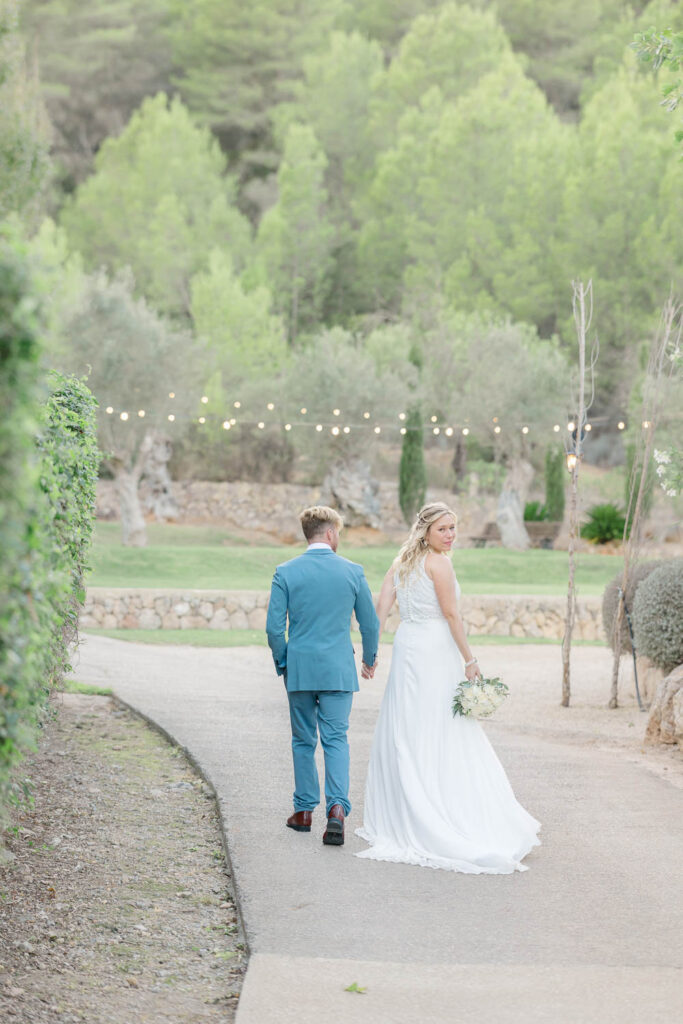 groom and bride walking away