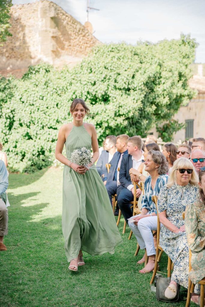 mallorca wedding bridesmaid walking down the aisle