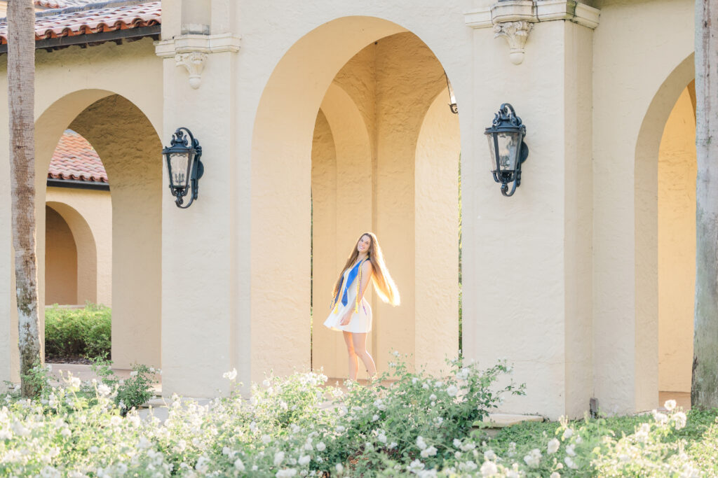 girl twirls for senior portrait