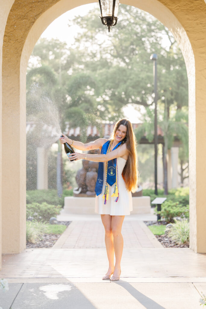 senior pops champange at rollins college winter park