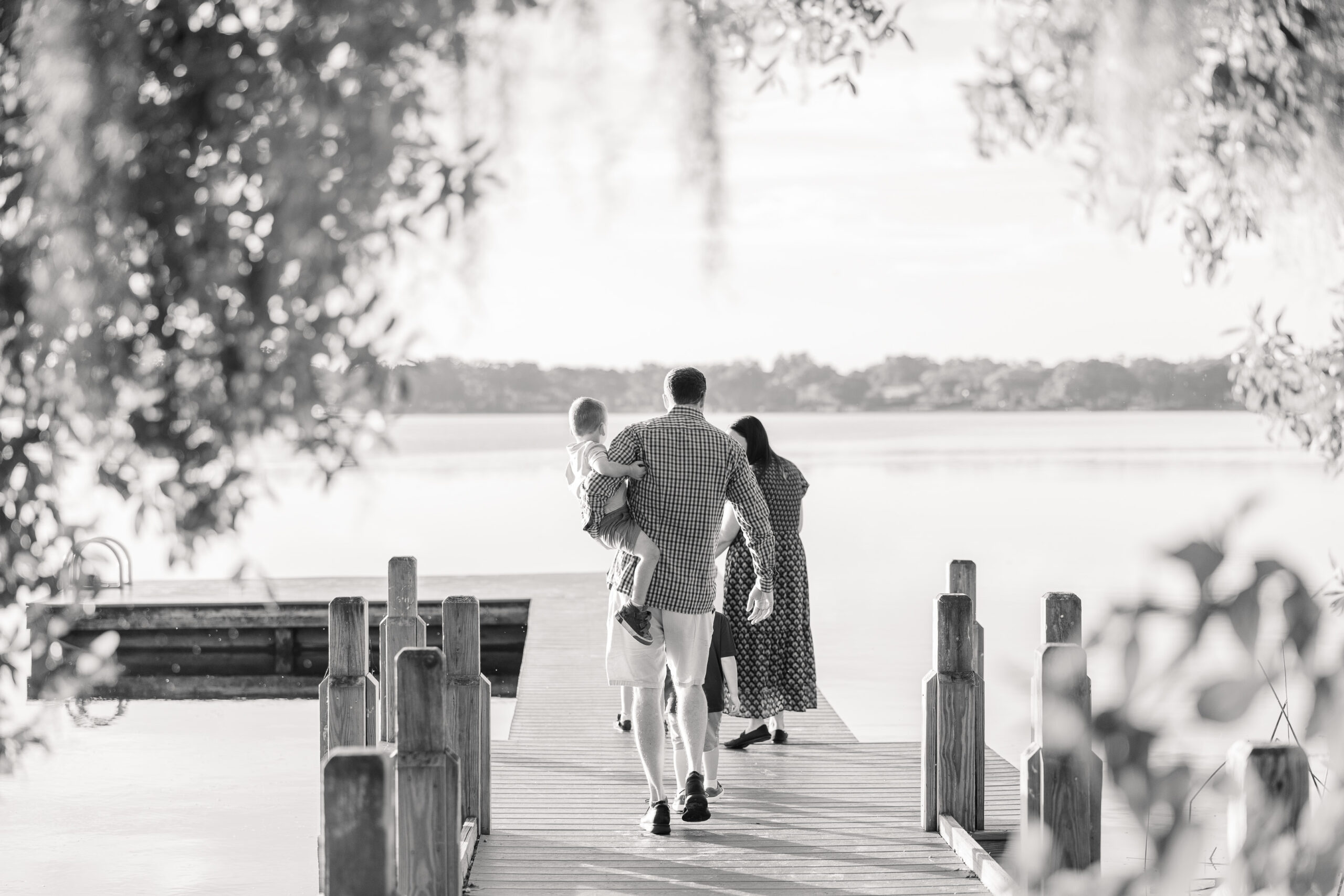 family walking on dock at rollins college