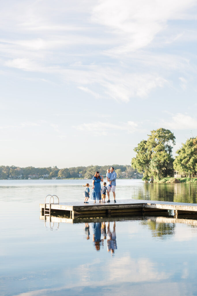 family on dock at lake victoria at rollins college
