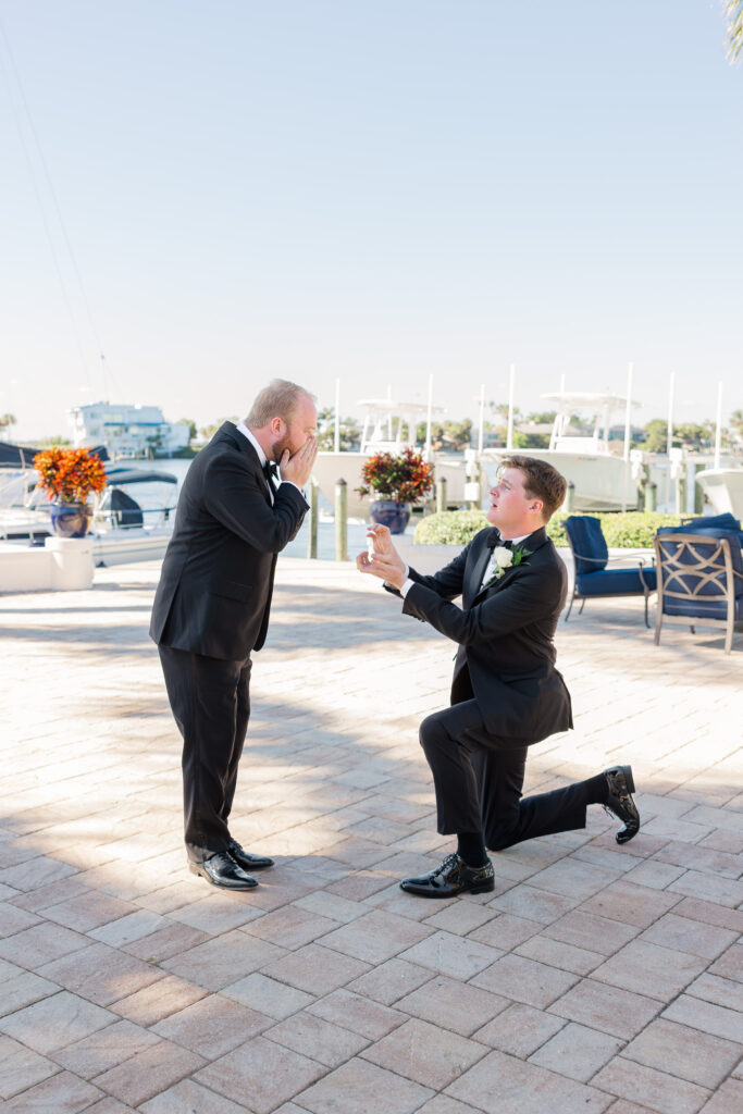 Groomsmen portraits by the boats at Florida yacht club wedding
