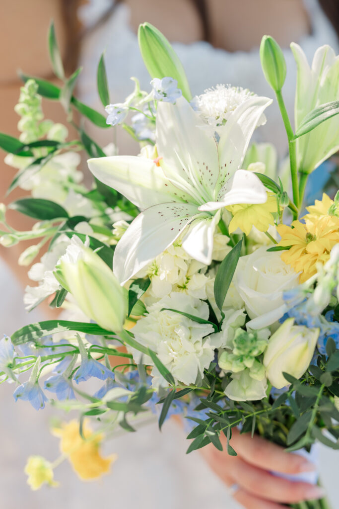 Blue and yellow wedding florals at Florida yacht club wedding
