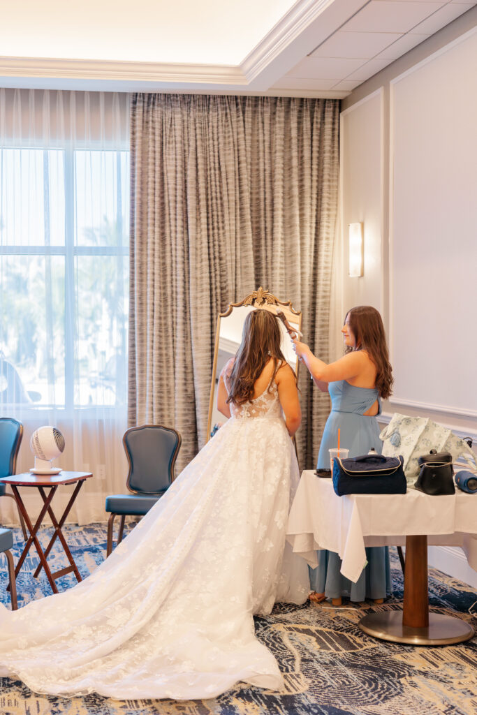 Bride getting ready with bridesmaids at Florida wedding yacht club