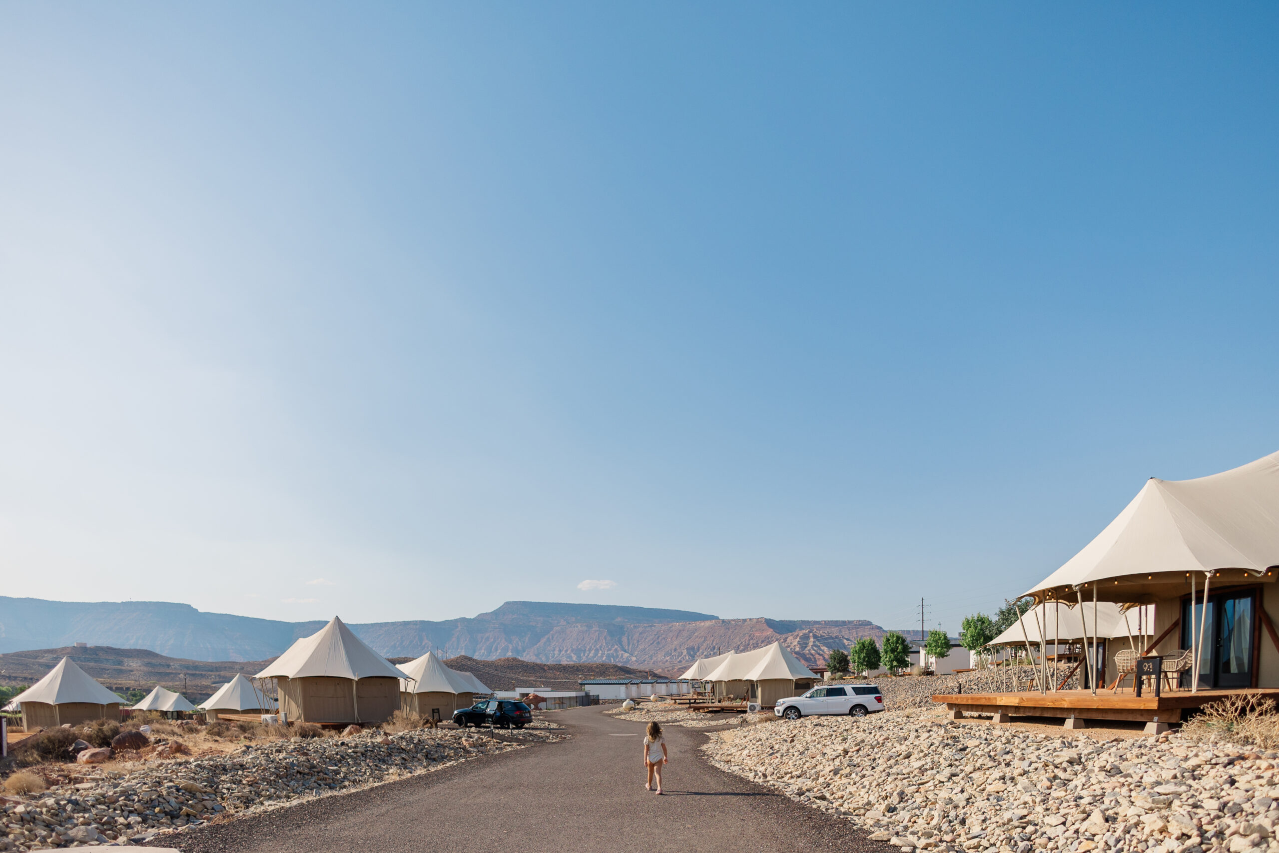 little girl walking through zion wildflower resort in utah