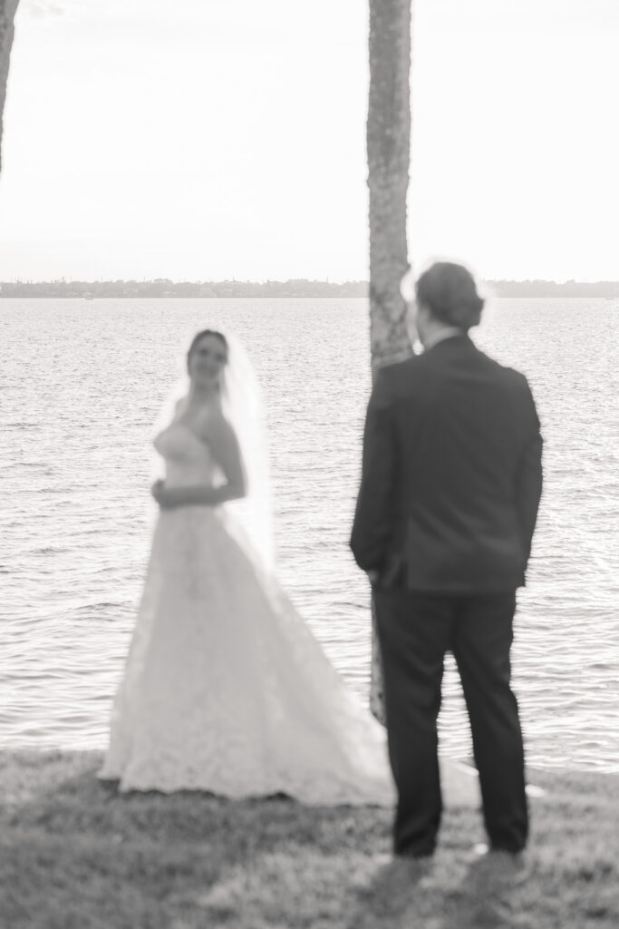Bride and groom walking together along Indian River after ceremony