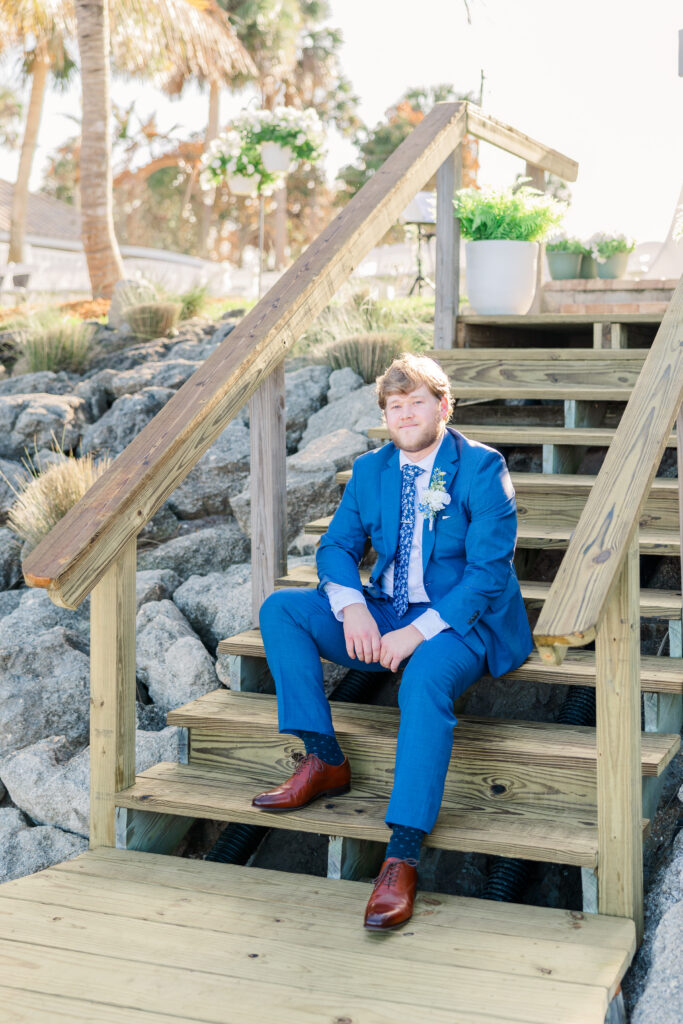 Groom and groomsmen portraits on dock during Merritt Island backyard wedding