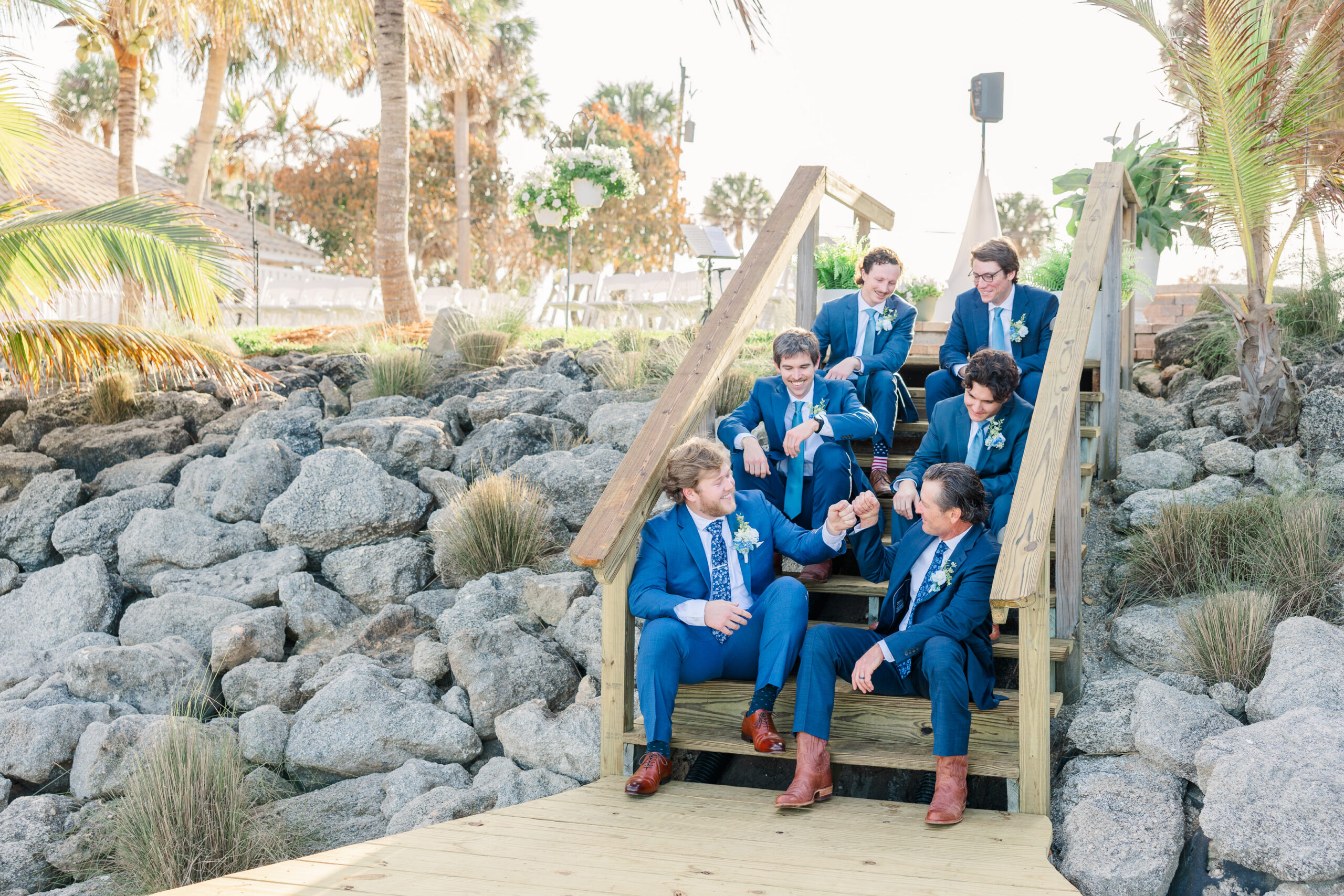 Groom and groomsmen portraits on dock during Merritt Island backyard wedding