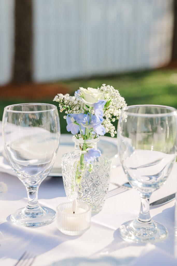 Wedding reception tablescape with florals at Merritt Island Florida backyard wedding