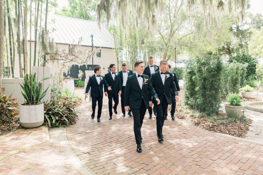 Groom and groomsmen black tie portraits