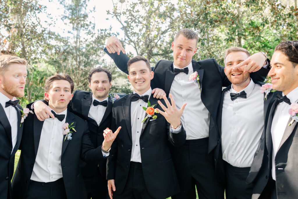 Groom and groomsmen black tie portraits