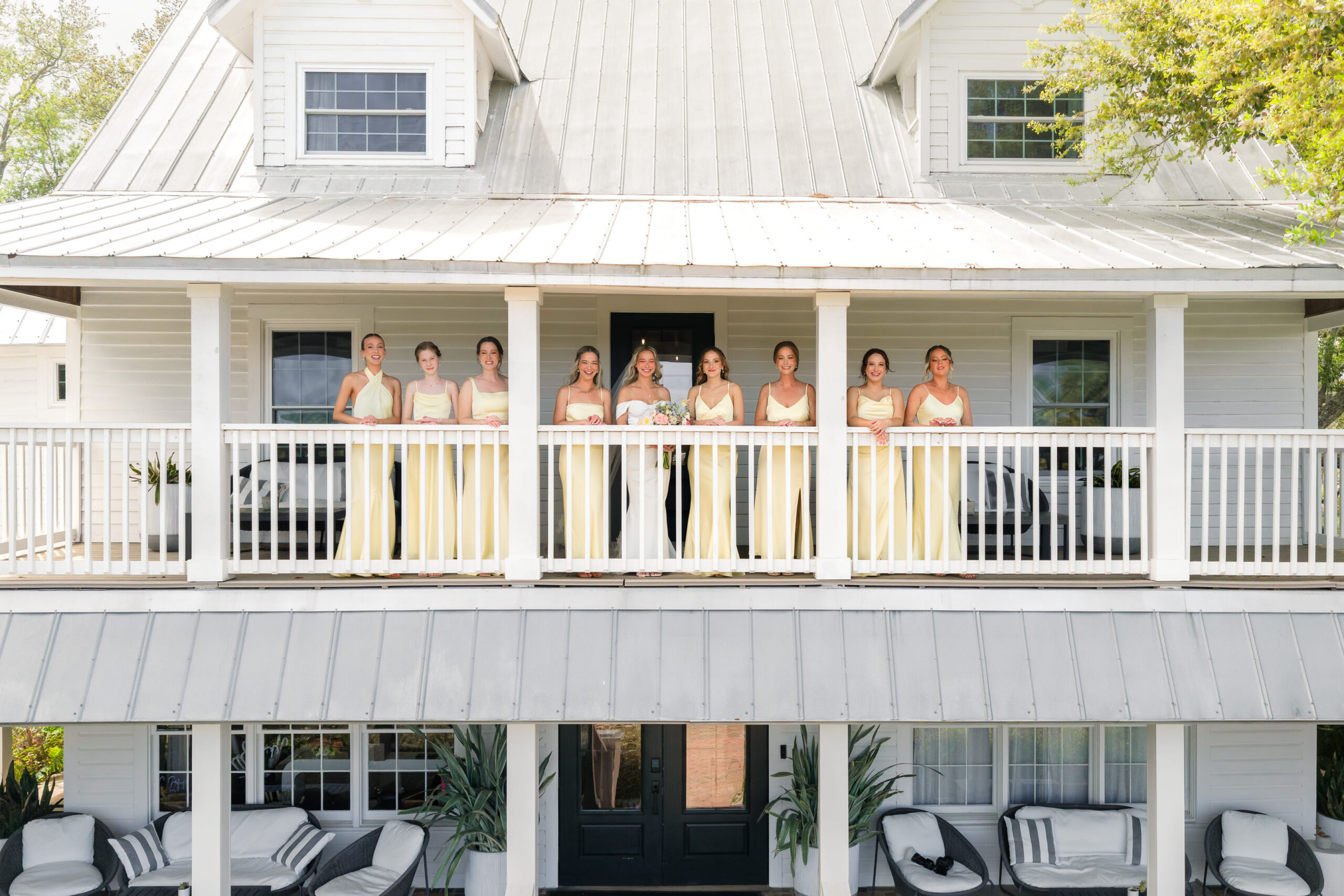 drone shot of bride and bridesmaids at Victoria 1883 wedding venue.