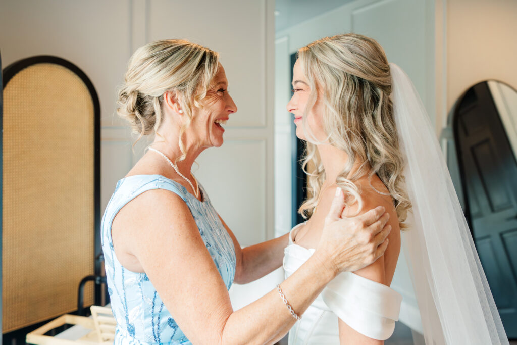 Bride getting ready with mother emotional wedding moment