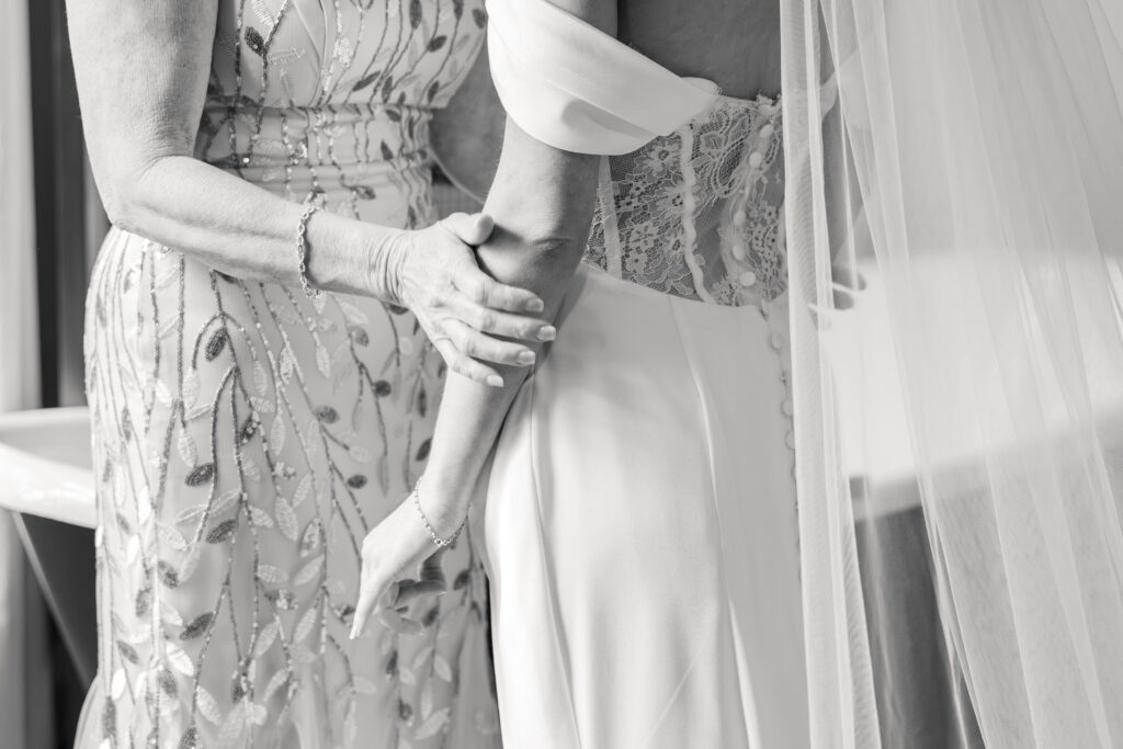 Bride getting ready with mother emotional wedding moment