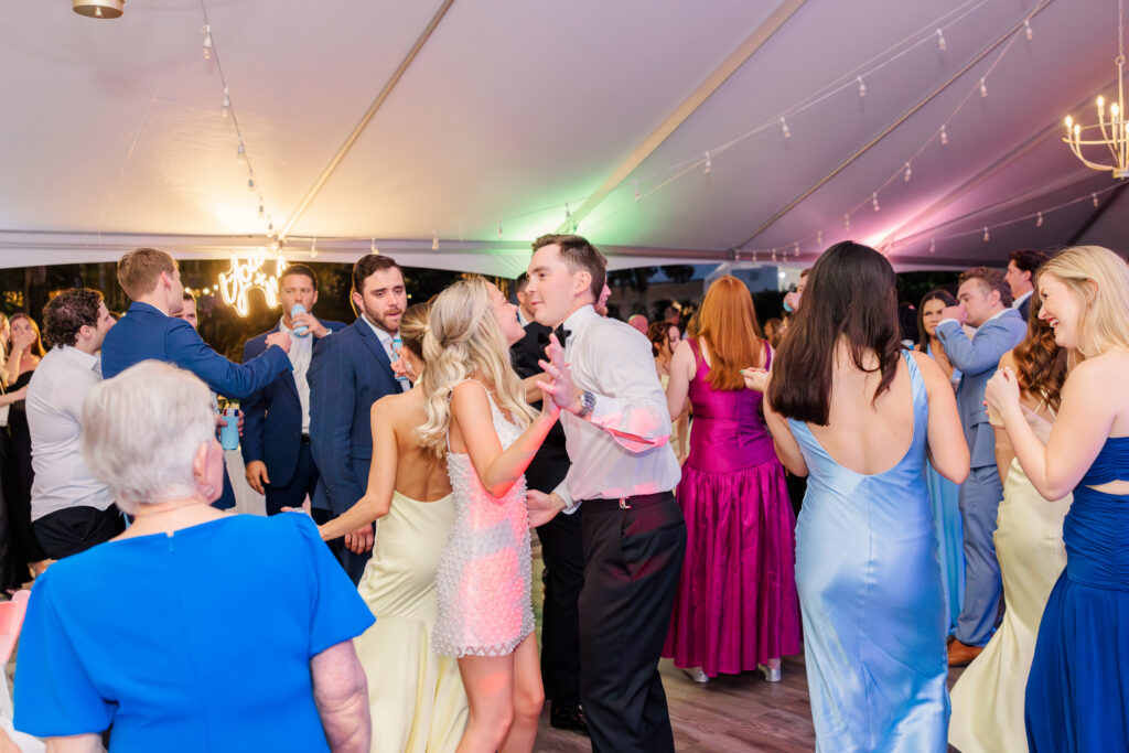 Wedding reception tent with dancing guests Florida wedding