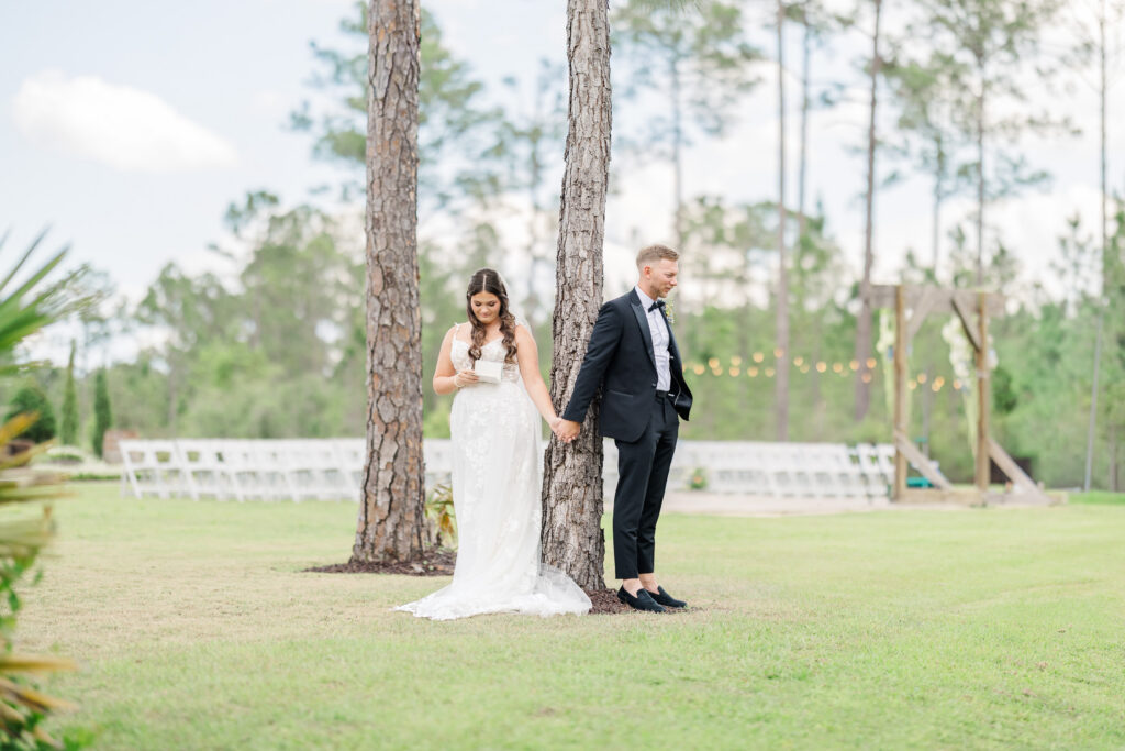 bride and groom share first touch outisde granville farms