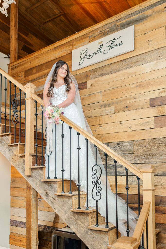 brides on stairs inside granville farms